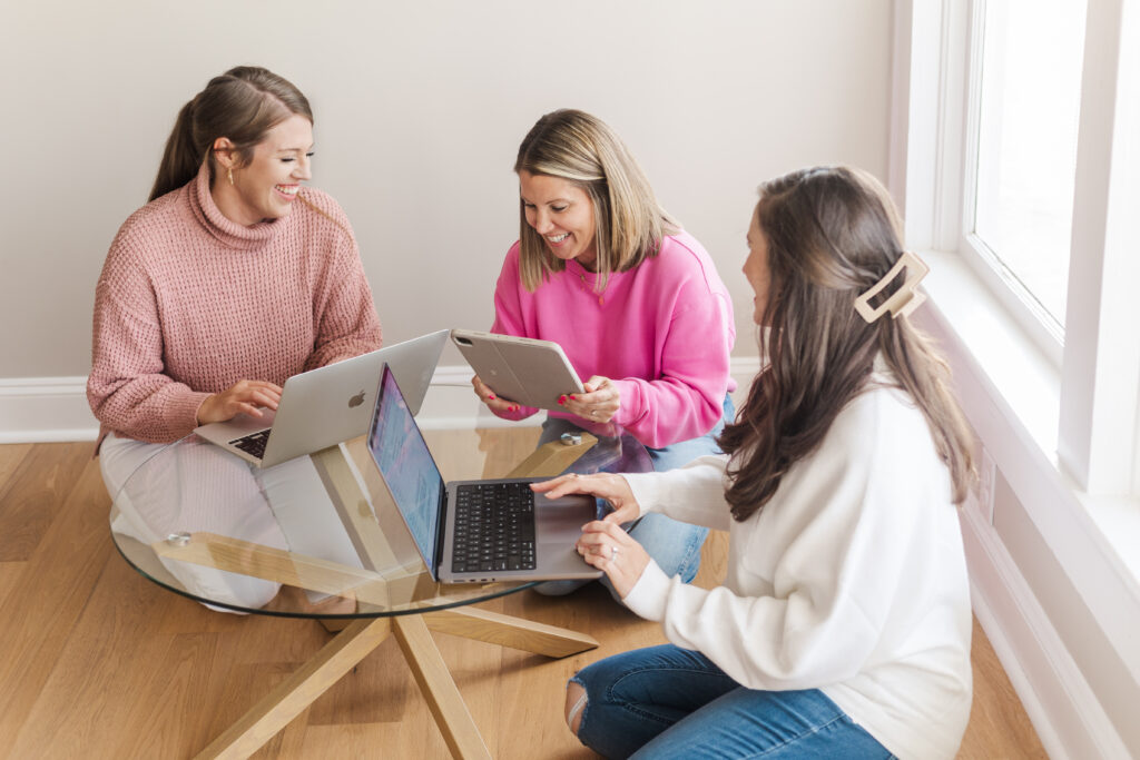 three integrator women at a computer